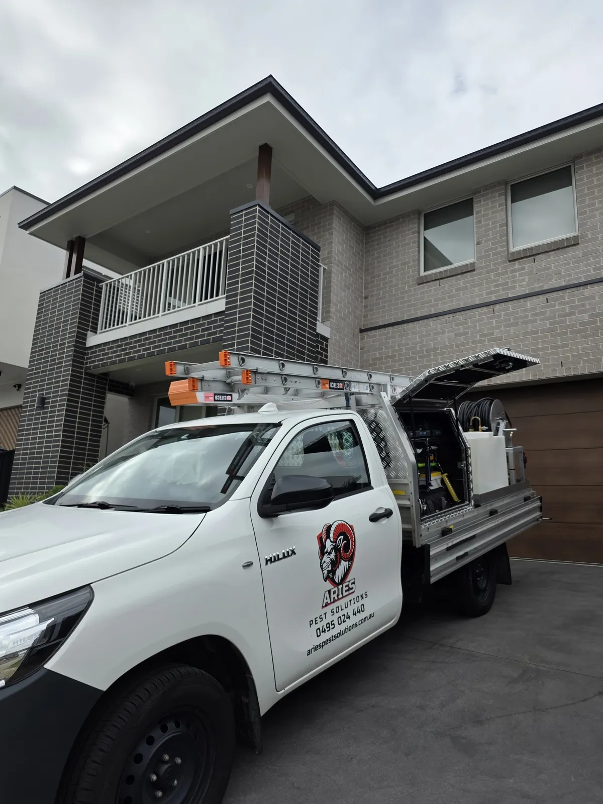 Aries Pest Solutions ute parked outside a Sydney home